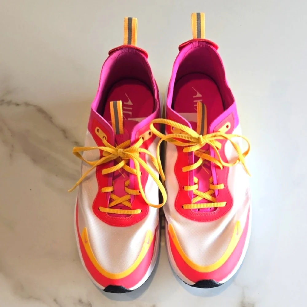 Nike Pink and Yellow Athletic Shoes with Sleek Design - Picture 1 of 6